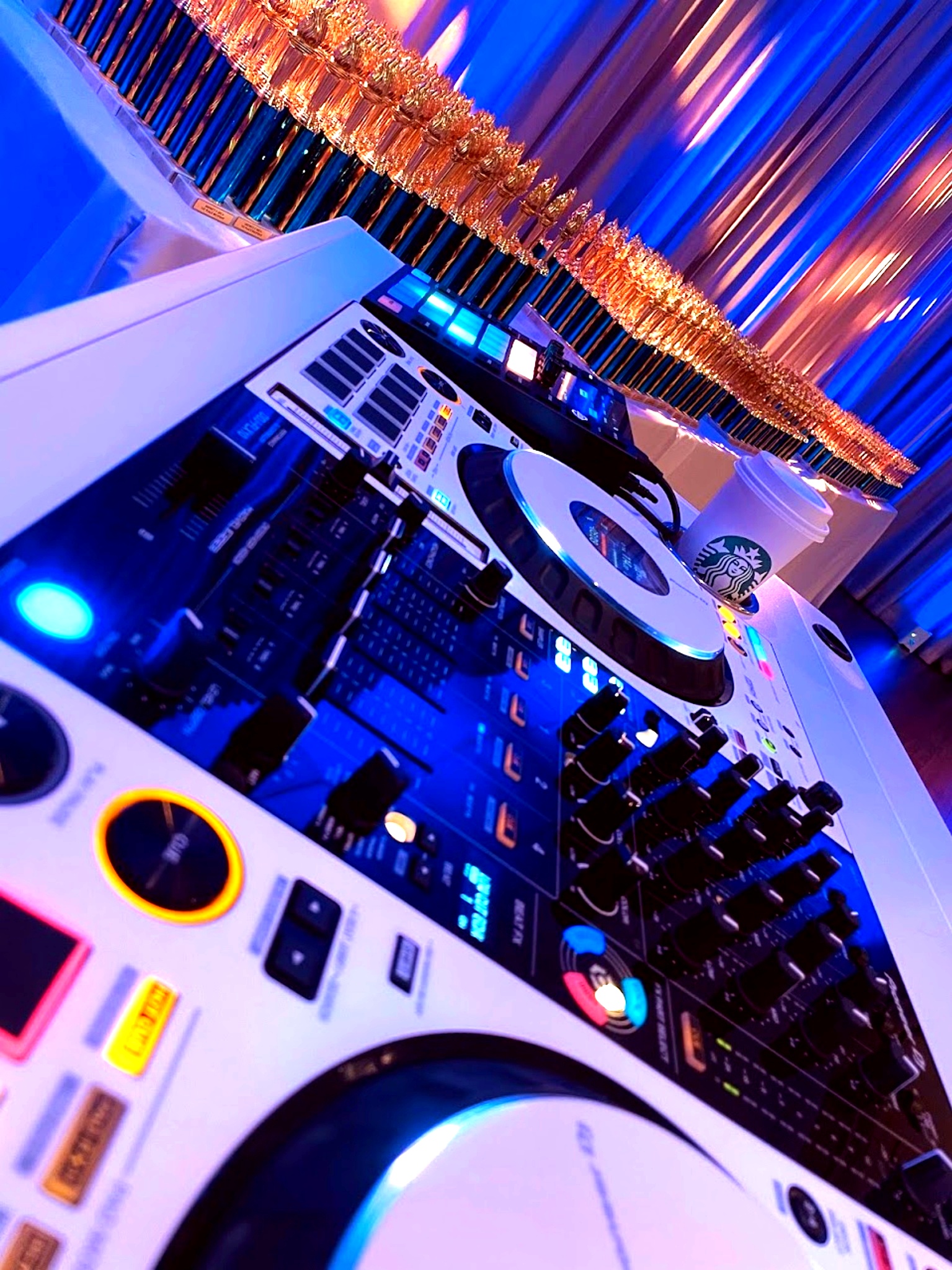 Turntables and Starbucks on an event table