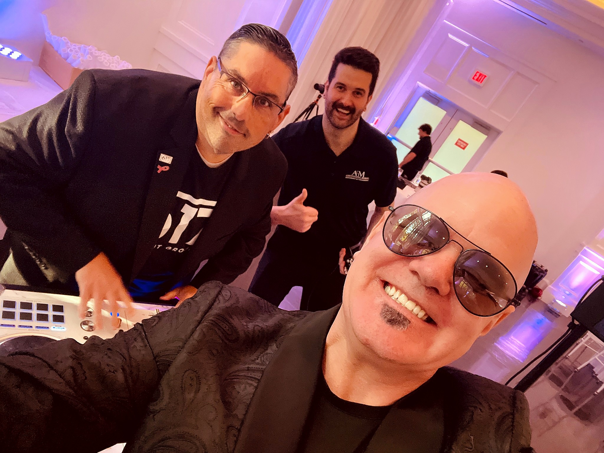 Mashup Charlie with team members at an event