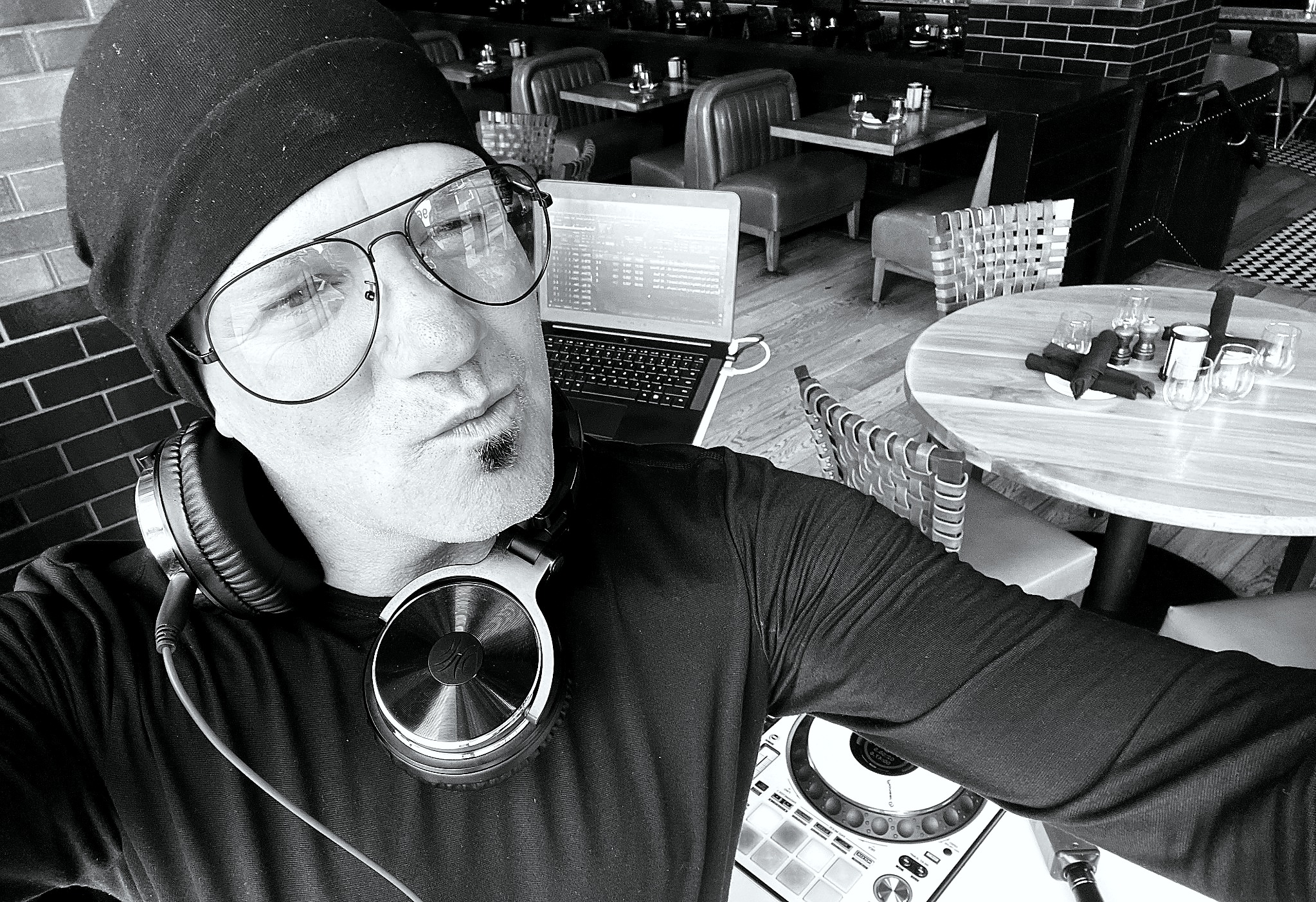 Mashup Charlie in a black-and-white venue setup portrait